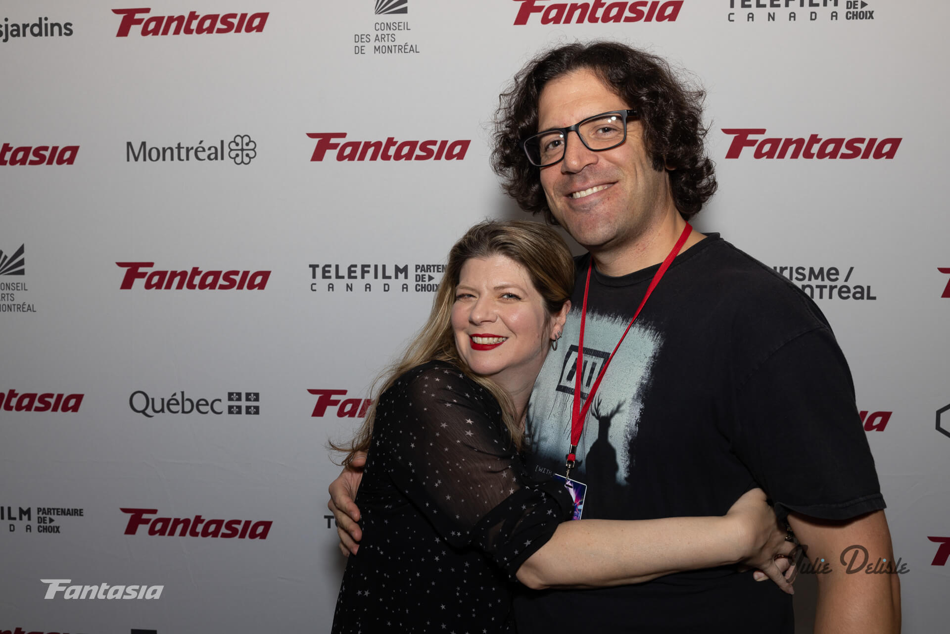 Izzy Lee And Steve Johanson At Fantasia Film Festival Rd Carpet Hugging And Smiling At The Camera.