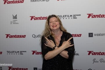 Izzy Lee At The Fantasia Film Festival Red Carpet Giving The Devil Horns With Both Hands