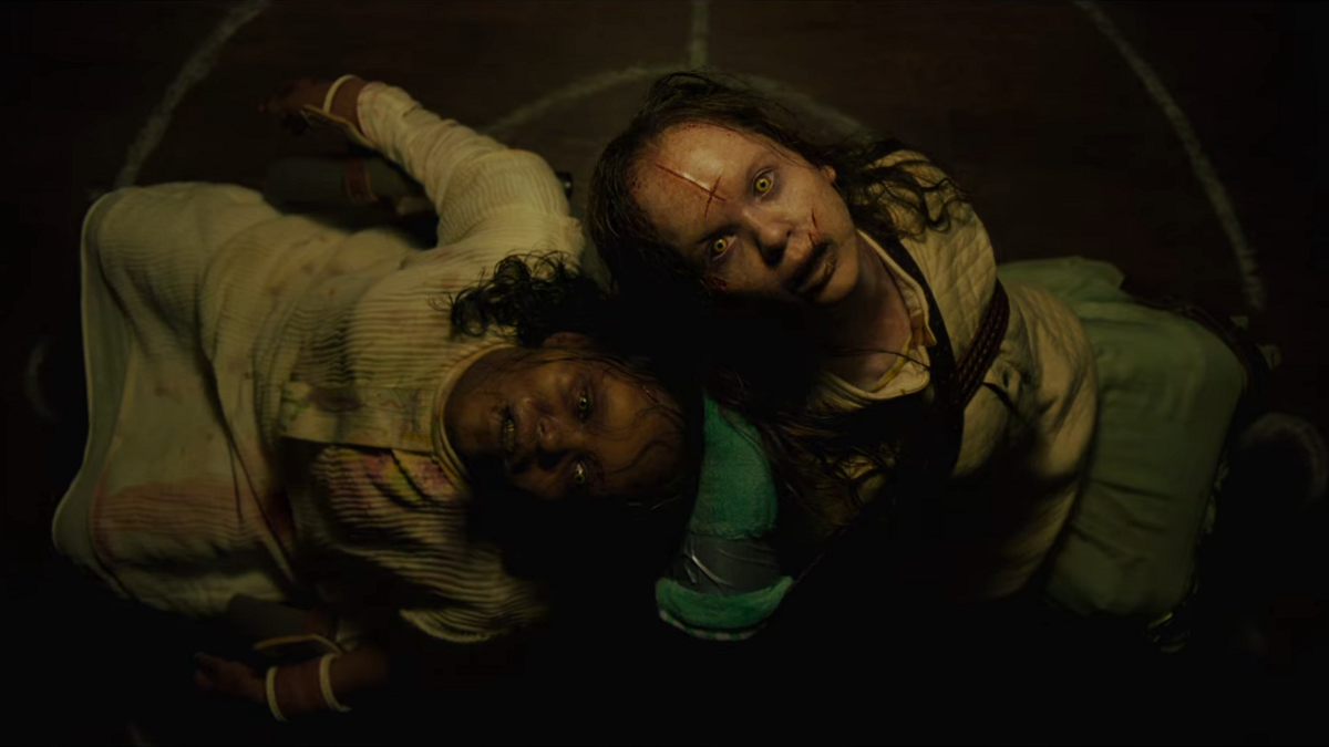 The Exorcist - Believer (2023) Possessed Angela and Katherine are tied to chairs, staring up at the ceiling with evil yellow eyes, a crucifix carved into the foreheads.