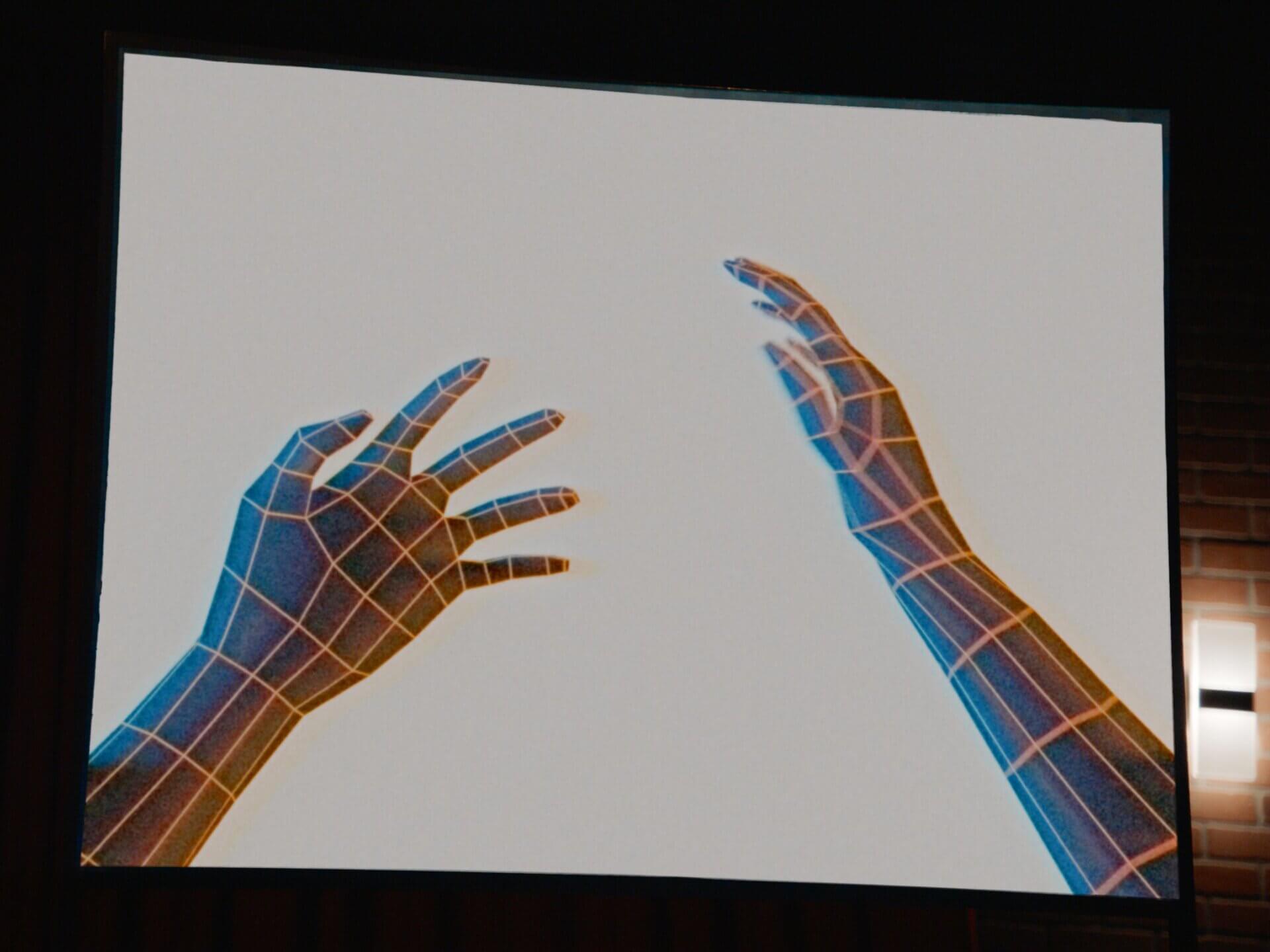 8-Bit virtual reality hands against a blank white backdrop.