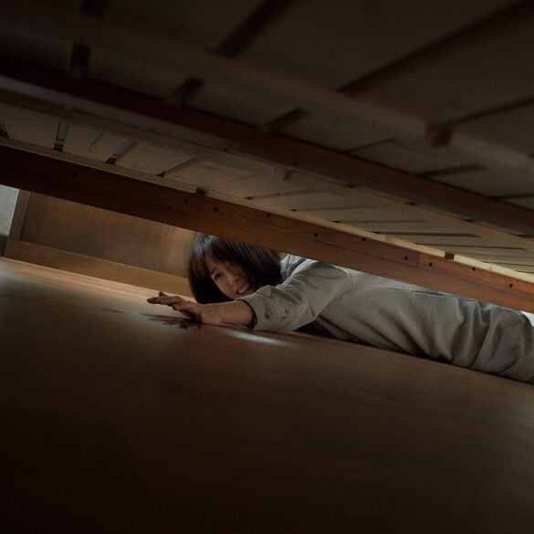 A Nervous Jung Yu-mi Reaches Under The Bed For Something In The Dark