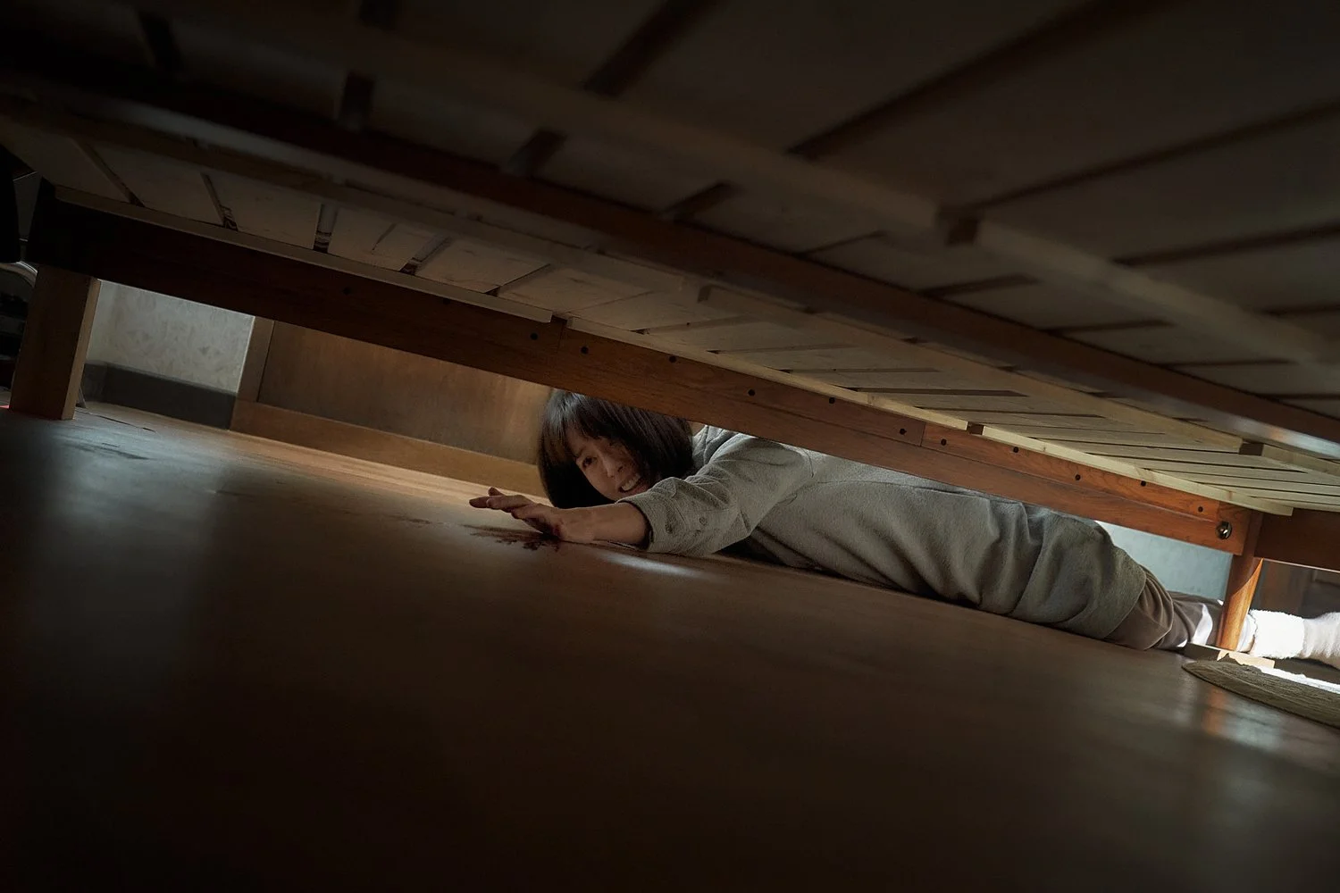 A Nervous Jung Yu-mi Reaches Under The Bed For Something In The Dark