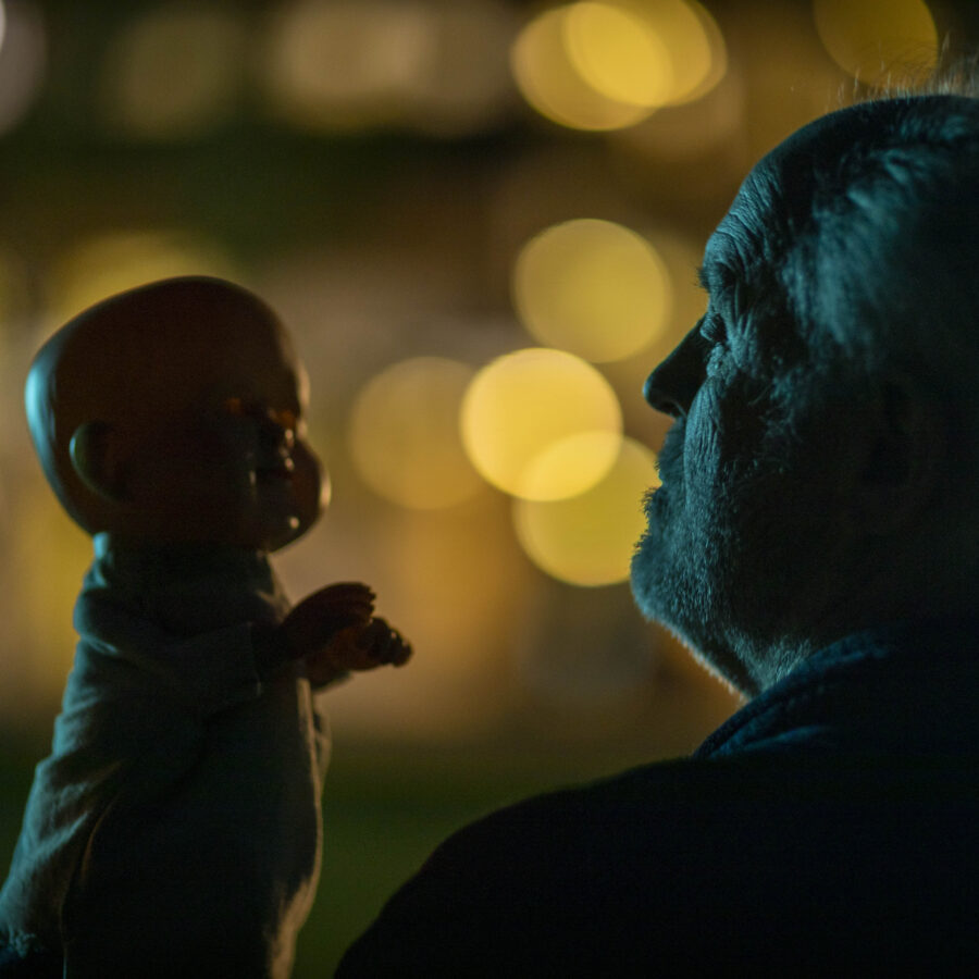 THE RULE OF JENNY PEN (2025) - John Lithgow as Dave Crealy talks with his hand Puppet Jenny Pen in the moonlight