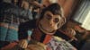 The Monkey (2025) - The Monkey Doll Bangs on His Drum with his creepy eyes wide open, baring his porcelain teeth