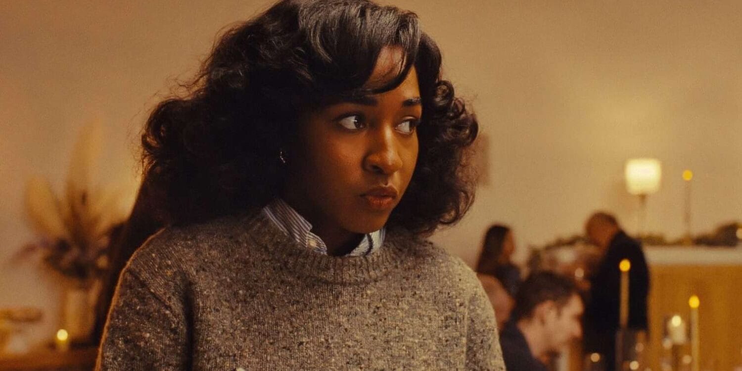 Opus (2025) Ayo Edebiri Looks around, nervously taking notes during a strange dinner party