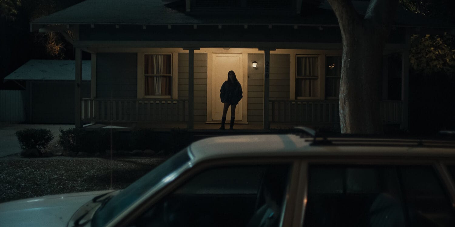 Inde Navarrette stars as Nikki in OBSESSION, a Focus Features release. Silhouette of Nikki standing on the porch