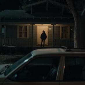Inde Navarrette stars as Nikki in OBSESSION, a Focus Features release. Silhouette of Nikki standing on the porch