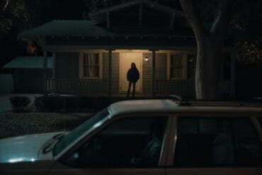 Inde Navarrette stars as Nikki in OBSESSION, a Focus Features release. Silhouette of Nikki standing on the porch