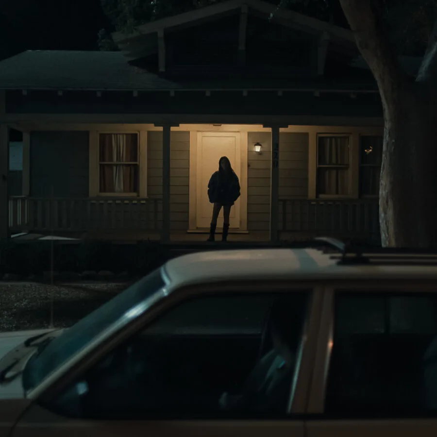 Inde Navarrette stars as Nikki in OBSESSION, a Focus Features release. Silhouette of Nikki standing on the porch