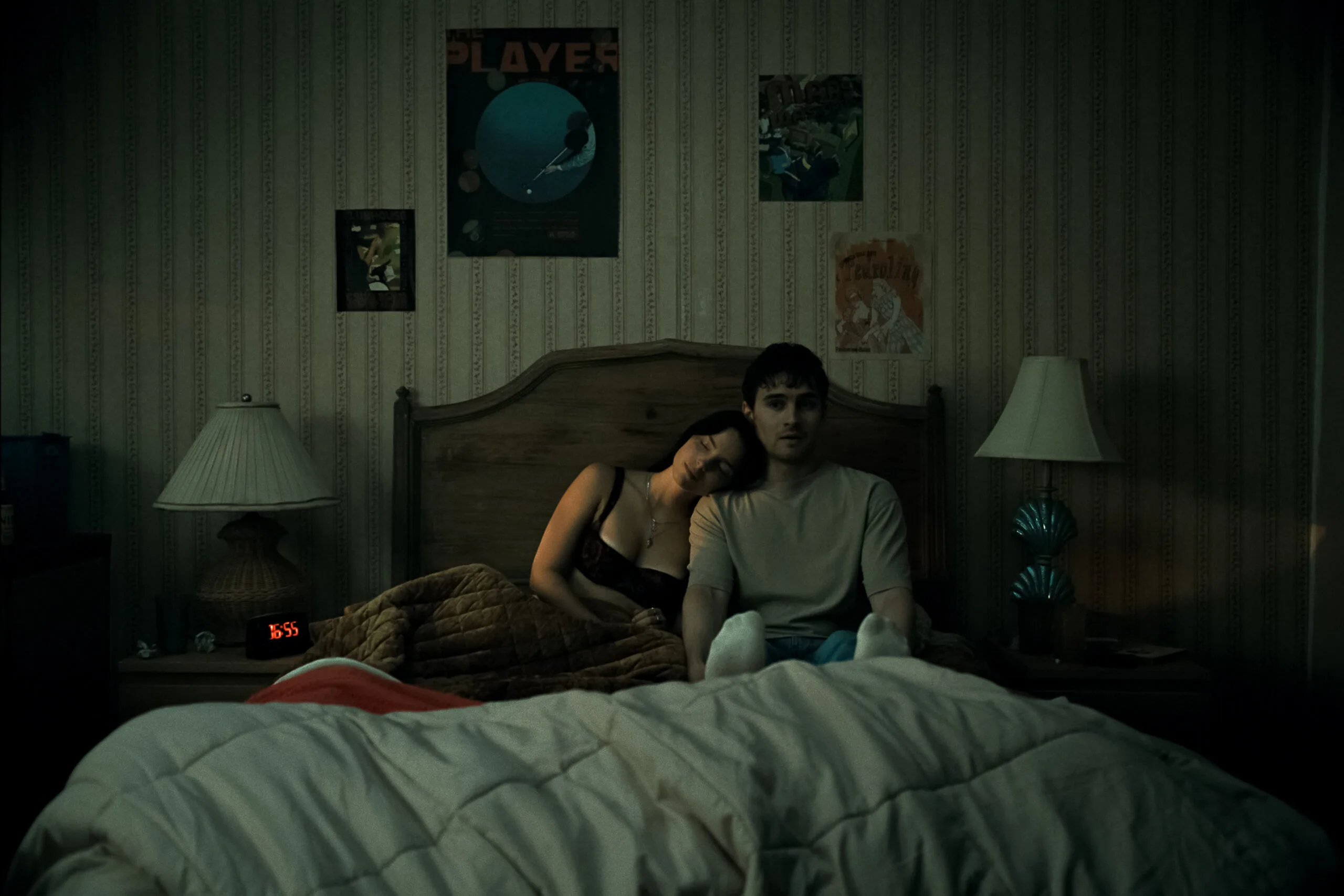 OBS FP 00039 R scaled OBSESSION Review: The Most F*cked Up Horror Version of Romeo & Juliet 10 Inde Navarrette stars as Nikki and Michael Johnston as Bear in OBSESSION, a Focus Features release. Nikki and Bear Sitting next to each other in Bed
