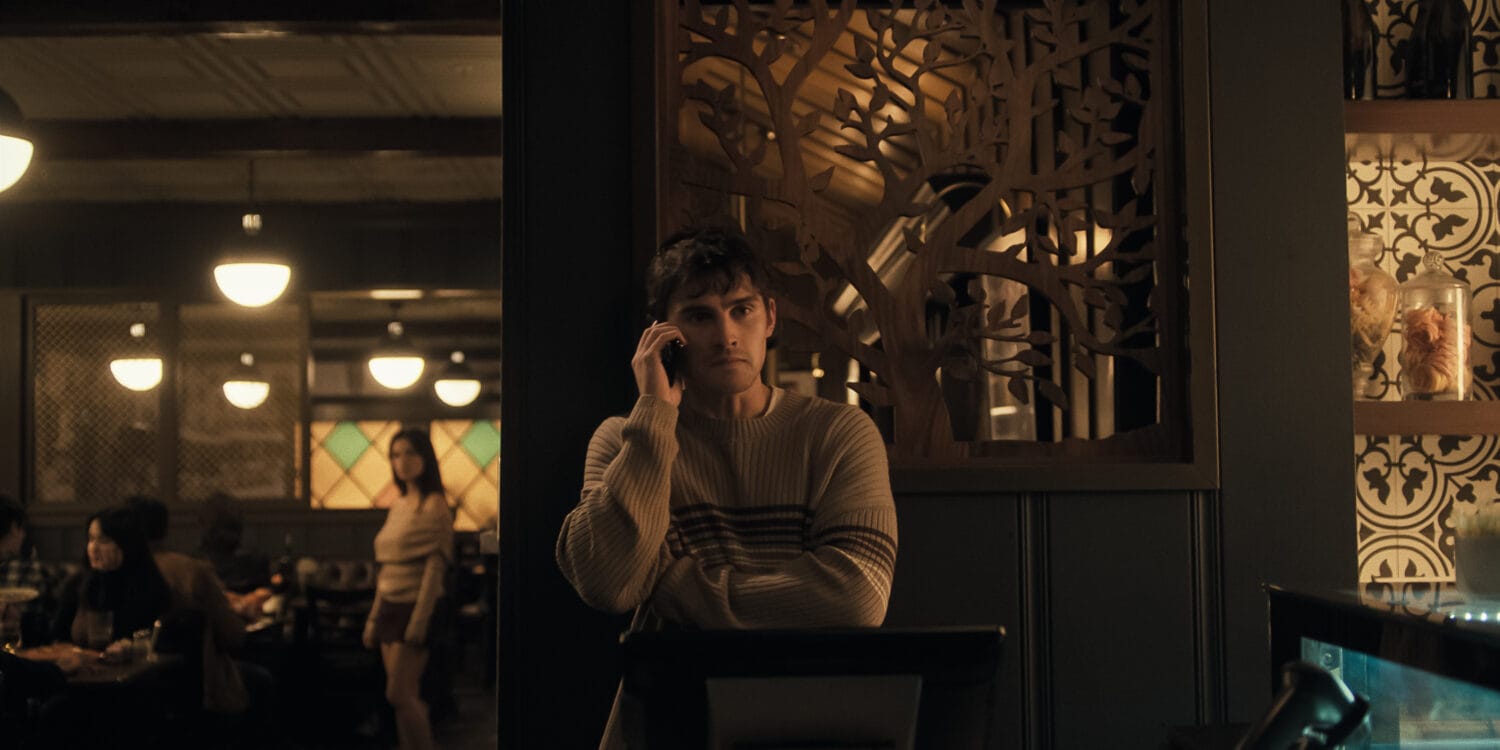 Inde Navarrette stars as Nikki and Michael Johnston as Bear in OBSESSION, a Focus Features release. Scene: Bear on The Phone While Nikki Watches Him Creepily in the Background