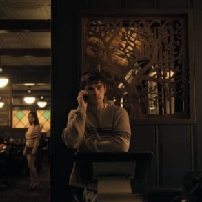 Inde Navarrette stars as Nikki and Michael Johnston as Bear in OBSESSION, a Focus Features release. Scene: Bear on The Phone While Nikki Watches Him Creepily in the Background